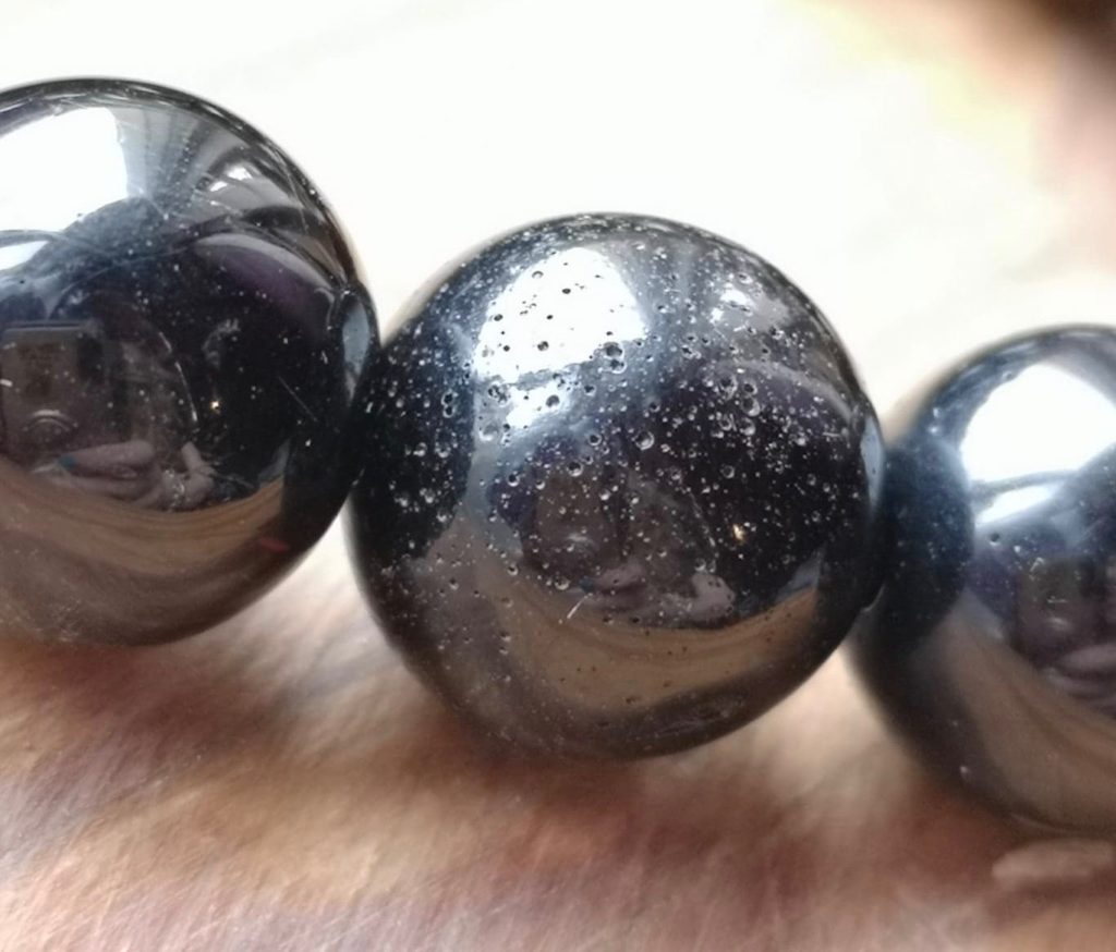 Reconstituted jet beads